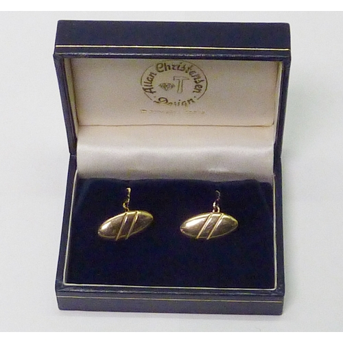 311 - A pair of Allan Christensen Design chain-link cufflinks, 9ct gold, London 1994.  Heads 23 x 10mm and... 