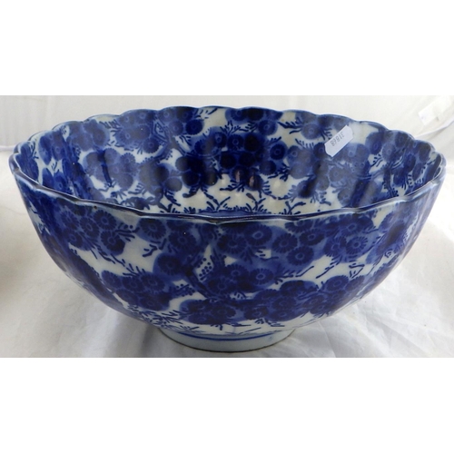 162 - An Oriental blue and white bowl 25cm diameter together with a restored charger (2)