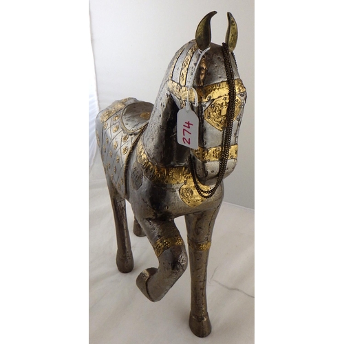 274 - An Oriental gilt and white metal horse 49cm tall