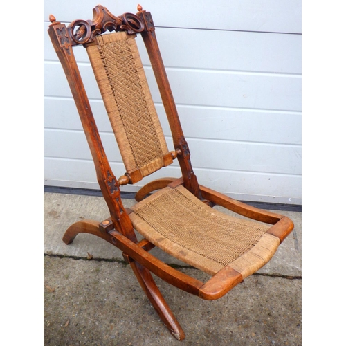 772 - A small Victorian walnut folding chair with string back & seat , 72cm tall