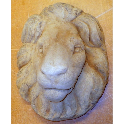 778 - A concrete lion mask, 41cm across