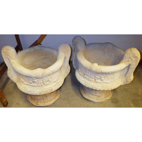 785 - A pair of two handled concrete garden planters 37cm across, not including handles