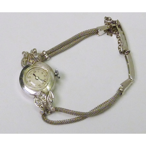 396 - A ladies cocktail watch comprising a jewelled lever movement within an unmarked white metal case hav... 