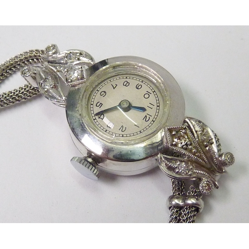 396 - A ladies cocktail watch comprising a jewelled lever movement within an unmarked white metal case hav... 