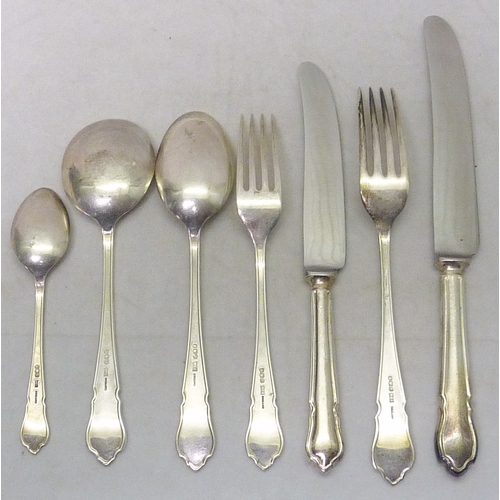 402 - A six place canteen of silver cutlery comprising table and dessert knives and forks, soup, dessert a... 