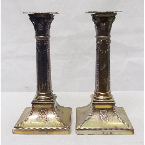 404 - A pair of late Victorian candlesticks, Thomas Bradbury & Sons, London 1899.  190mm tall