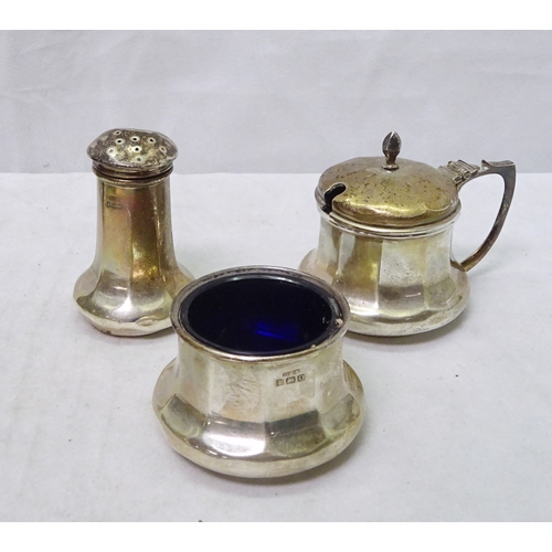 406 - A silver four piece condiment set comprising a mustard pot, two table salts and a pepper pot, with b... 