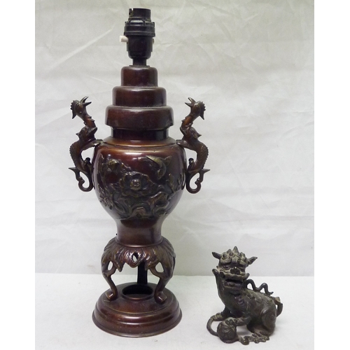 273 - A Chinese temple lion / dog of fo in cast bronze, 11cm tall, a/f; a Chinese censer / vase table lamp... 