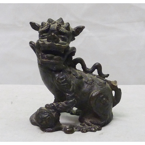 273 - A Chinese temple lion / dog of fo in cast bronze, 11cm tall, a/f; a Chinese censer / vase table lamp... 