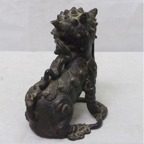 273 - A Chinese temple lion / dog of fo in cast bronze, 11cm tall, a/f; a Chinese censer / vase table lamp... 