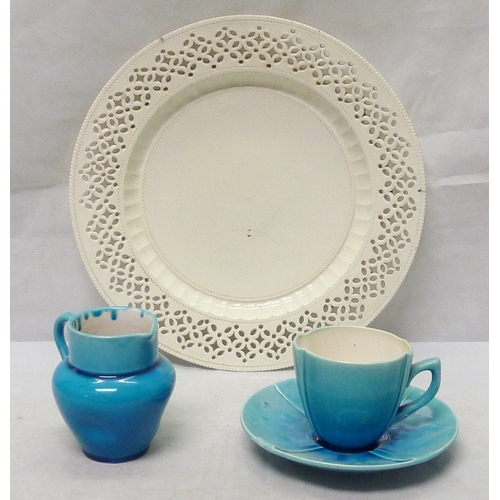 206 - A Burmantofts Faience coffee cup and saucer, bearing impressed marks 