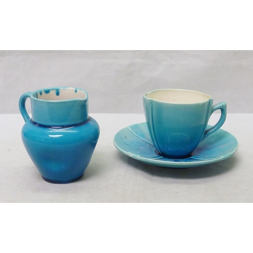 206 - A Burmantofts Faience coffee cup and saucer, bearing impressed marks 