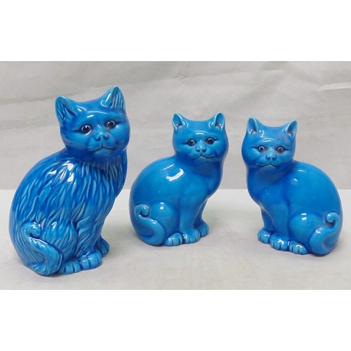 207 - A pair of blue faience cat figures, 132mm tall; another similar.  (3)
