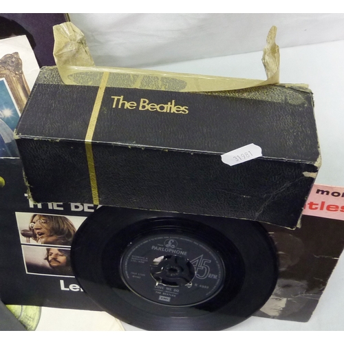 213 - Vinyl records: a The Beatles cased Singles Collection; other 45rpm singles incl The Beatles, etc.