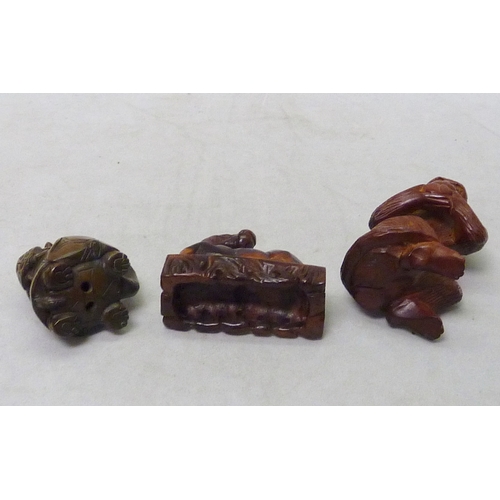 215 - A cased meerschaum pipe; a netsuke, and two other oriental carvings.
