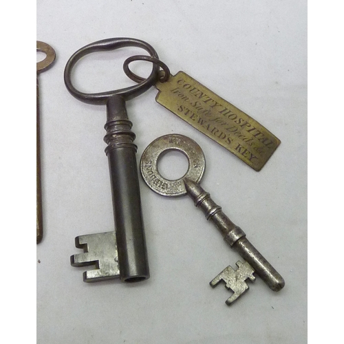216 - A 19th century key bearing a contemporary brass tag 