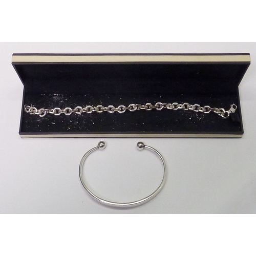 217 - A Links of London chain link bracelet, unmarked white metal; a silver torque bangle.