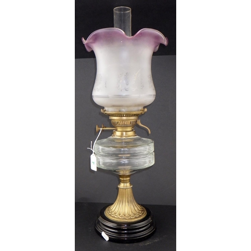 4 - A 19thC oil lamp 57cm tall to funnel