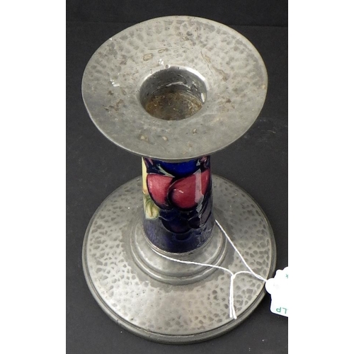 6 - A small Moorcroft Tudric pewter mounted candlestick 14cm tall