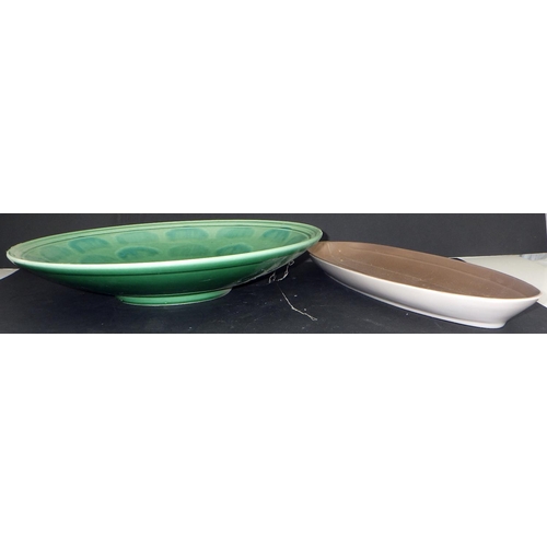 102 - A Poole pottery charger 35cm diameter together with a shallow narrow dish (2)