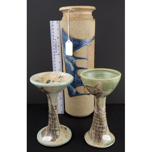 89 - Two Junko Shibe art pottery candlesticks together with a tall cylindrical stuido vase (3)