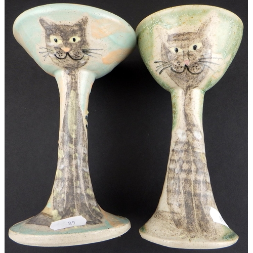 89 - Two Junko Shibe art pottery candlesticks together with a tall cylindrical stuido vase (3)