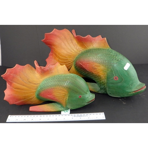 125 - Two colourful carved wooden carps