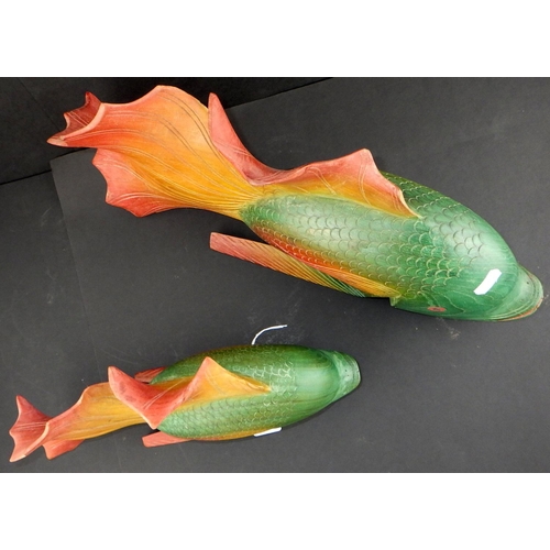 125 - Two colourful carved wooden carps