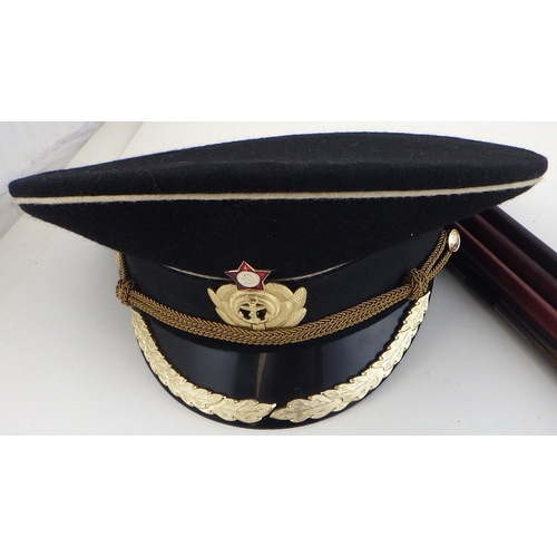198 - A Russian naval cap together with a shotgun cleaners (2)