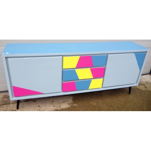 833 - A modern painted sideboard on metal feet, 201cm long
