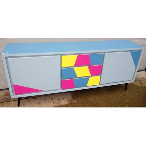 833 - A modern painted sideboard on metal feet, 201cm long