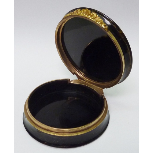 268 - A tortoise shell box and hinged cover having yellow metal mounts and set with a miniature painting d... 