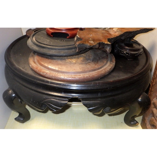 340 - An Oriental carved hardwood base together with misc stands