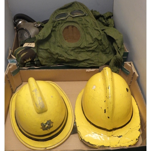 346 - Two yellow fire brigade helmets, a Soviet era full gas mask suit, other gas masks etc  (2)