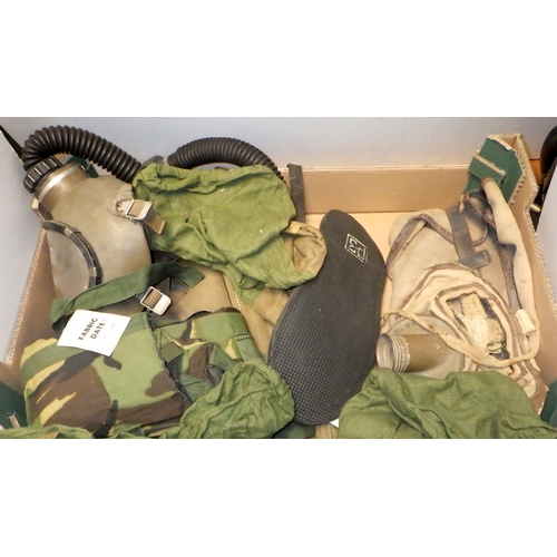 346 - Two yellow fire brigade helmets, a Soviet era full gas mask suit, other gas masks etc  (2)