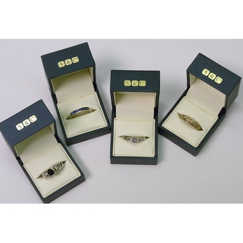 251 - Three white metal stone set rings; a gilt white metal stone set ring.  All boxed.  (4)