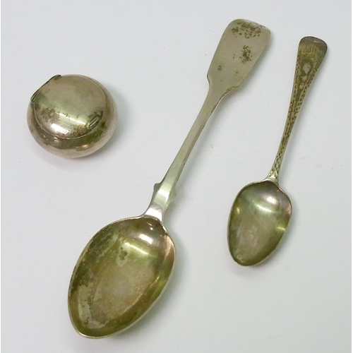 253 - A silver snuffbox, 37mm diameter; two silver spoons.