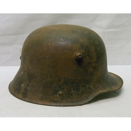 345 - Military interest: a German m16 Stahlhelm helmet with three piece padded leather liner on leather ba... 