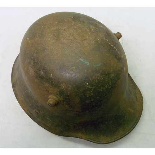 345 - Military interest: a German m16 Stahlhelm helmet with three piece padded leather liner on leather ba... 