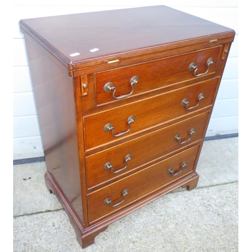 838 - A reproduction mahogany bachelors chest with fold over top, 61cm wide