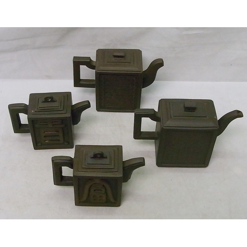 231 - A group of four Oriental square tea pots