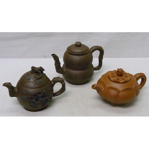 232 - A group of three Oriental tea pots, a/f