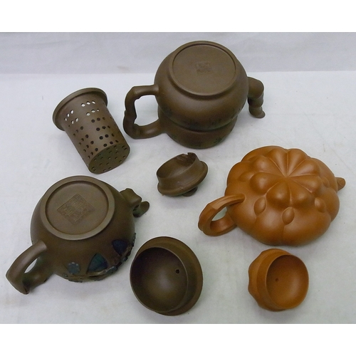 232 - A group of three Oriental tea pots, a/f