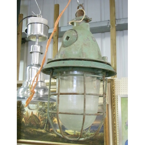 242 - An Industrial / Marine caged hanging lamp; an industrial style light fitting.  A/F