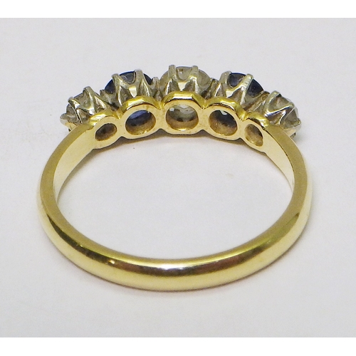 31 - An eternity ring comprising three brilliant cut diamonds and two brilliant cut sapphires, yellow met... 