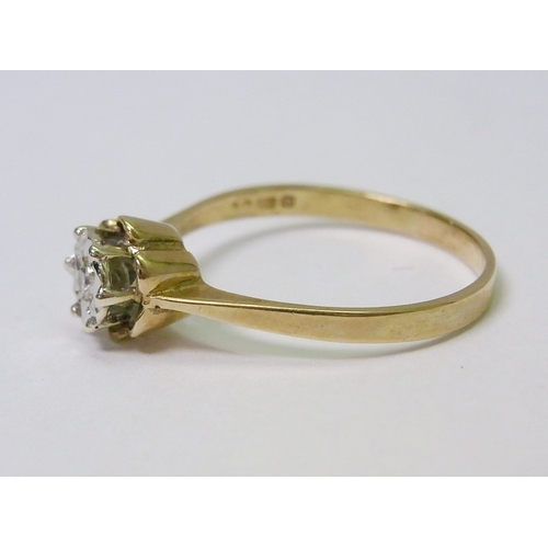 39 - A 9ct gold solitaire ring comprising a single brilliant cut diamond in a star-shaped illusion settin... 