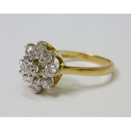 40 - A daisy cluster ring comprising eight brilliant cut diamonds surrounding a single diamond in an illu... 