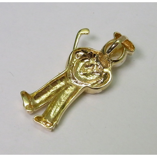 51 - A pendant modelled as a golfer, yellow metal marked 14k / 585, set with a pearl and white stones.  3... 