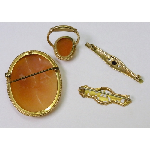 61 - A shell carved cameo brooch, 9ct gold oval mount, 42 x 32mm oval; a 9ct gold cameo ring, 3g gross; a... 