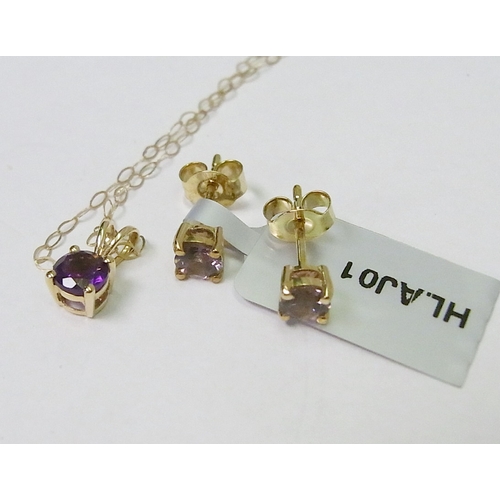 64 - A pair of yellow metal and spinel stud earrings; a yellow metal Amethyst pendant on a yellow metal c... 